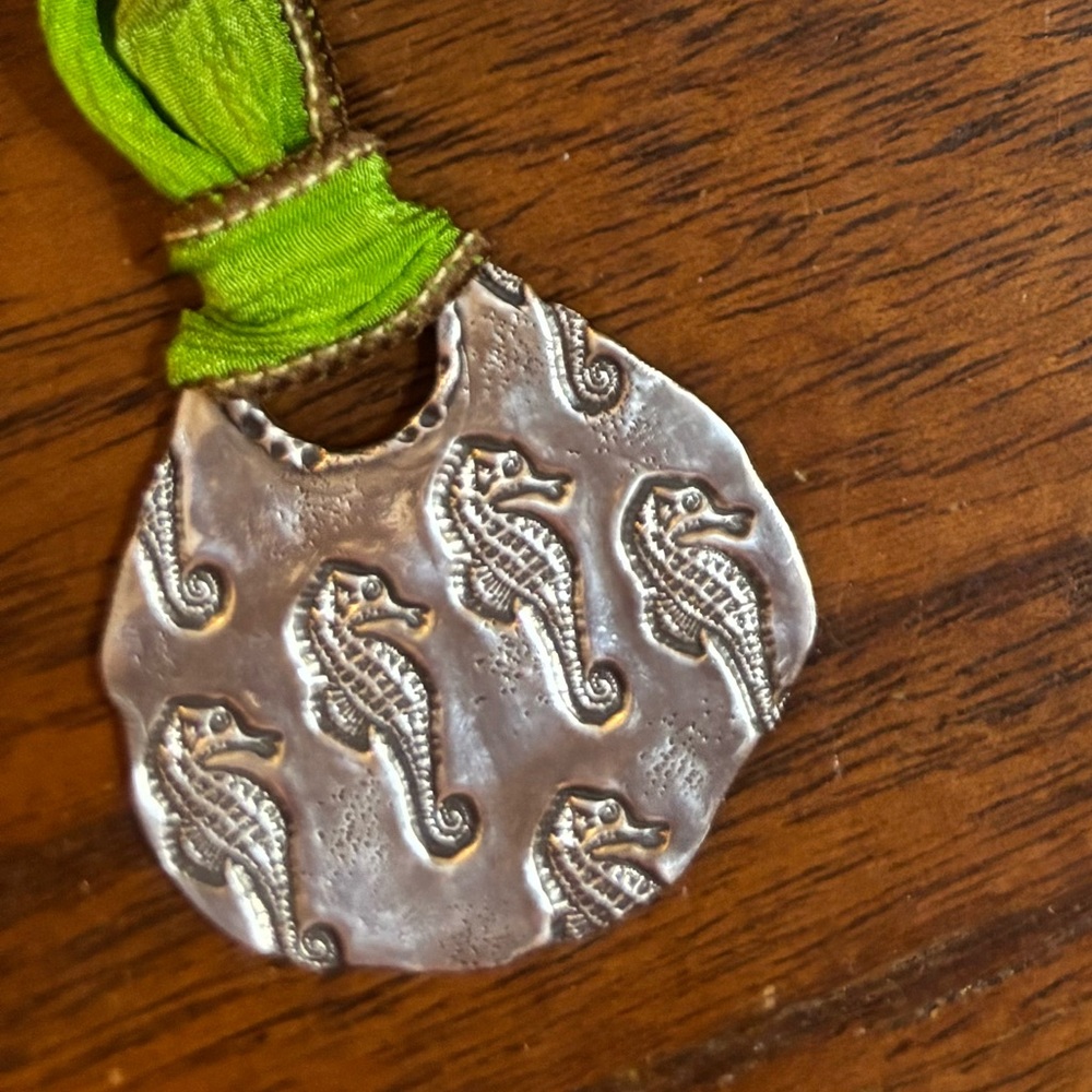 Intricate Silver Seahorse Pendant with Green Accent